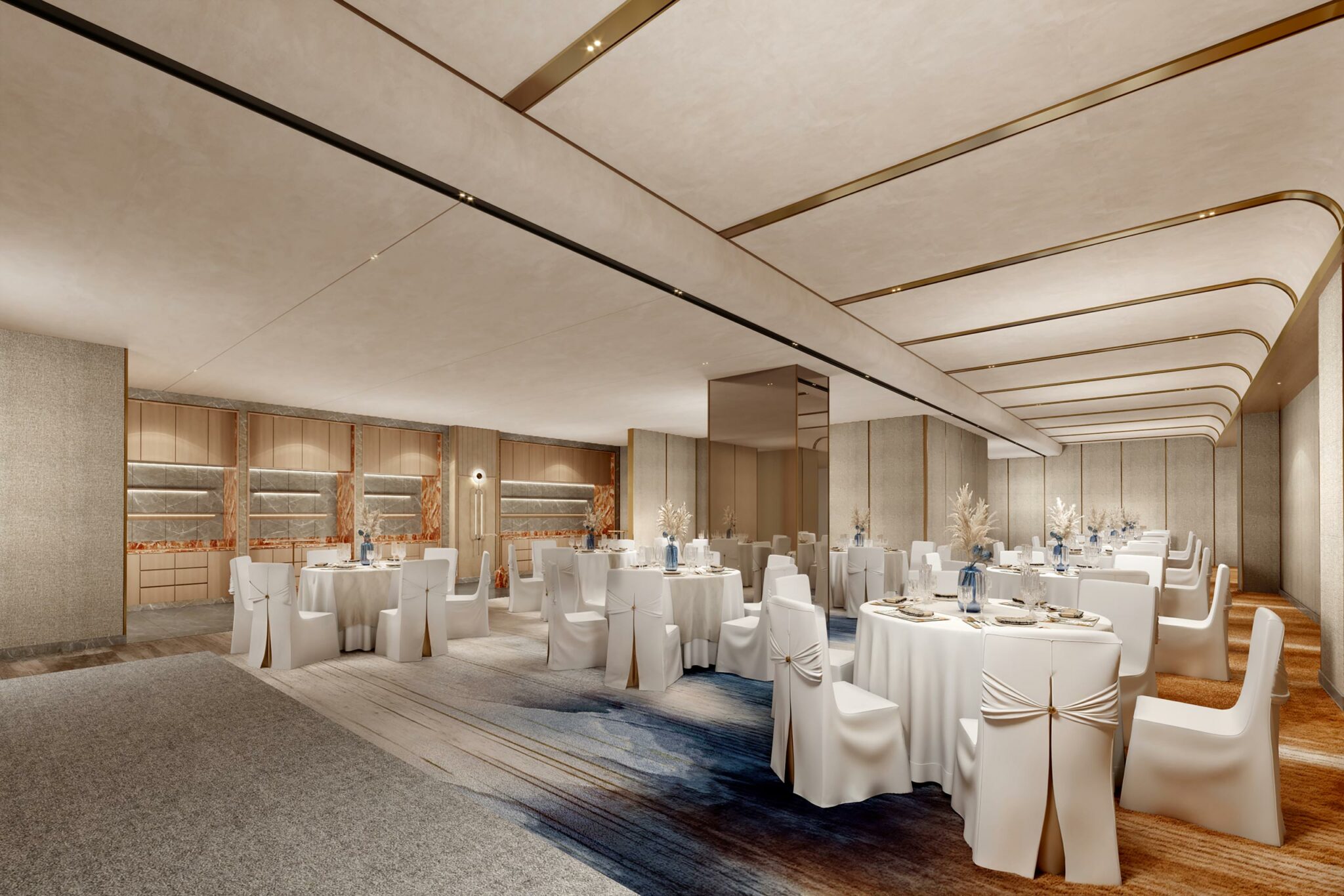Elegant banquet hall with round tables draped in white linens, surrounded by matching chairs. Soft lighting and neutral tones create a formal, inviting atmosphere.
