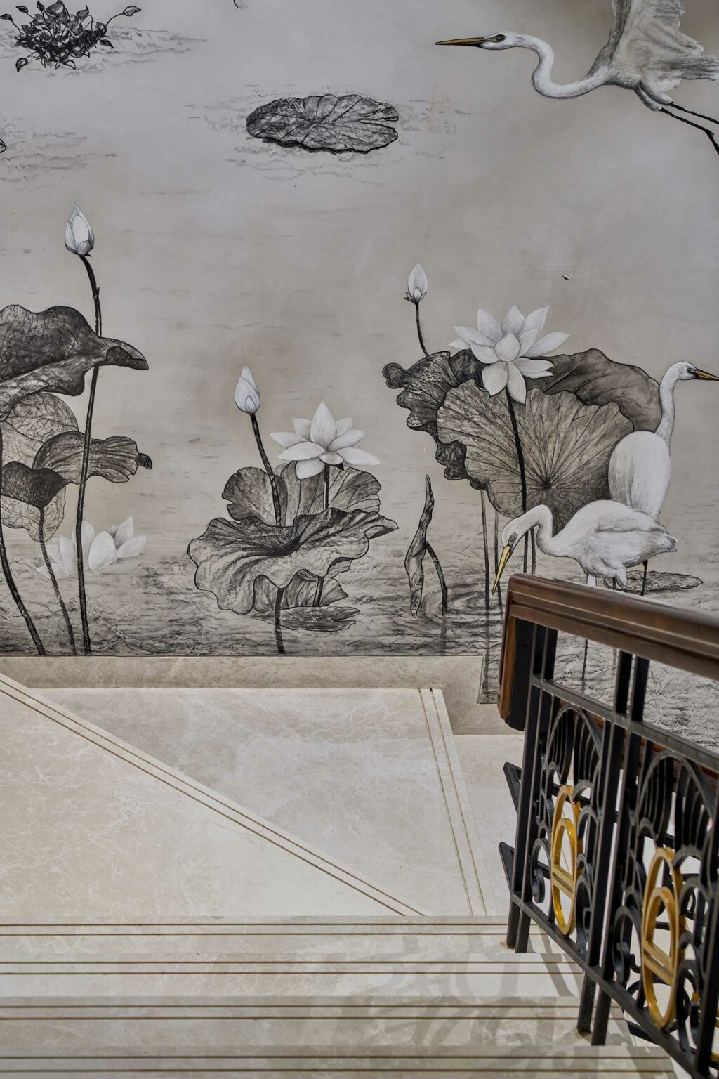 Marble staircase with ornate railings, set against a mural of cranes and lotus flowers. The grayscale palette evokes elegance and tranquility.